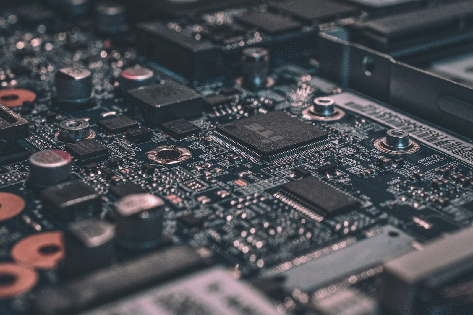 A macro close-up of a circuit board, representing the hardware and systems agents run on.