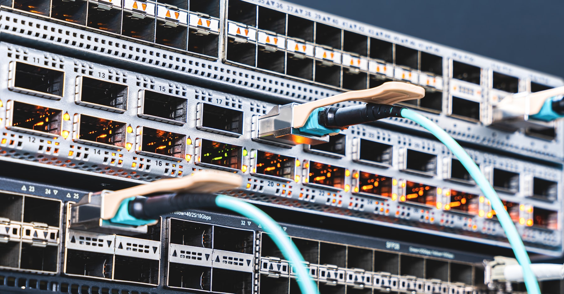 A network switch with fiber cables connected, representing infrastructure planning.